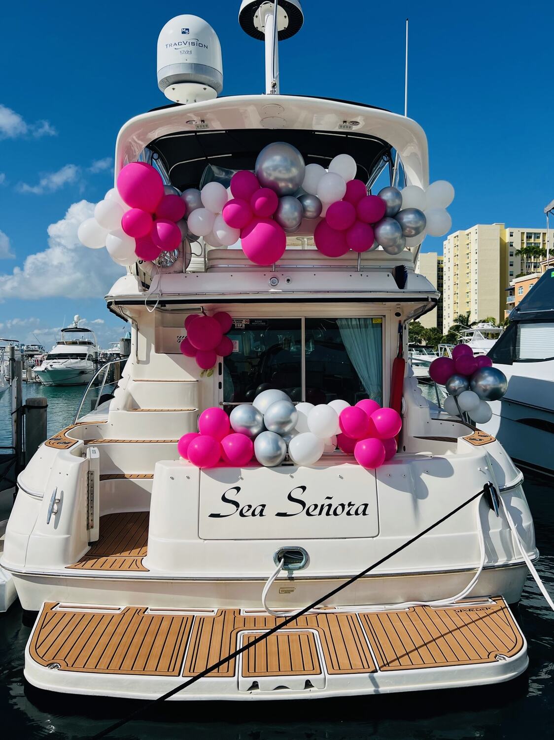 Sea Señora decorated with pink and silver balloons at the dock