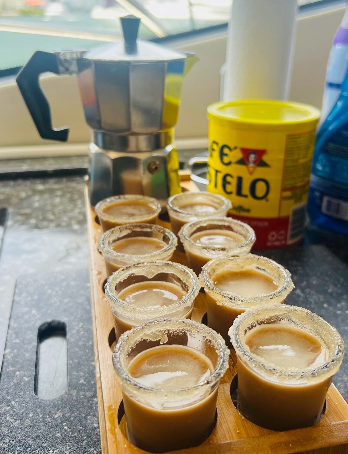 Cafecito shots with sugared rims served on board